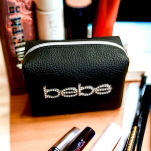 Bebe black monogram cosmetic bag NWOT 3.5x5.5x3 inches approximately zip close
